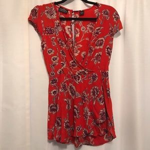 Red floral romper with deep v and skort